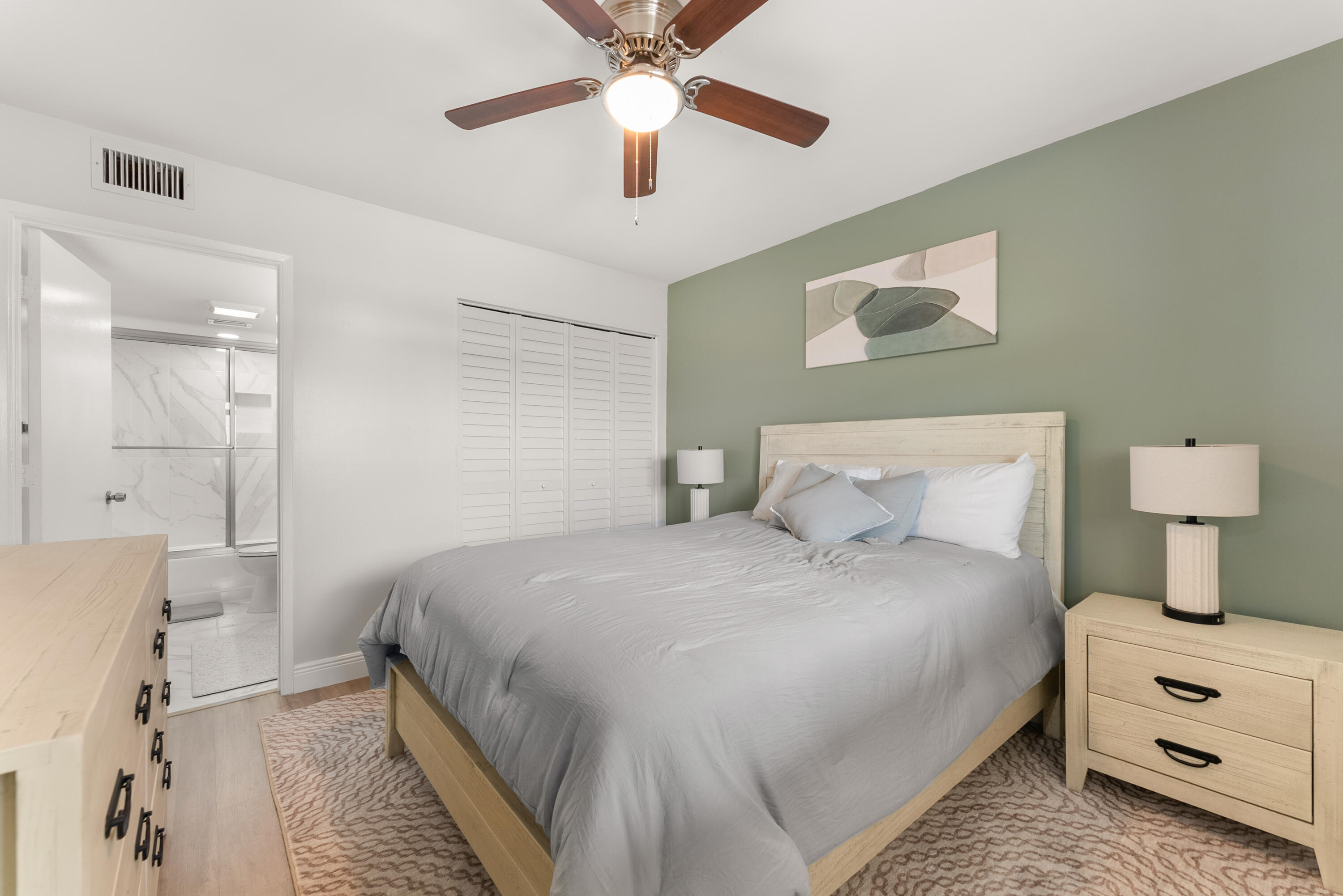 14500 Stirling Way, Unit 403 Delray Beach, FL 33446 - Photo 17 of 47 a bedroom with a bed and a lamp