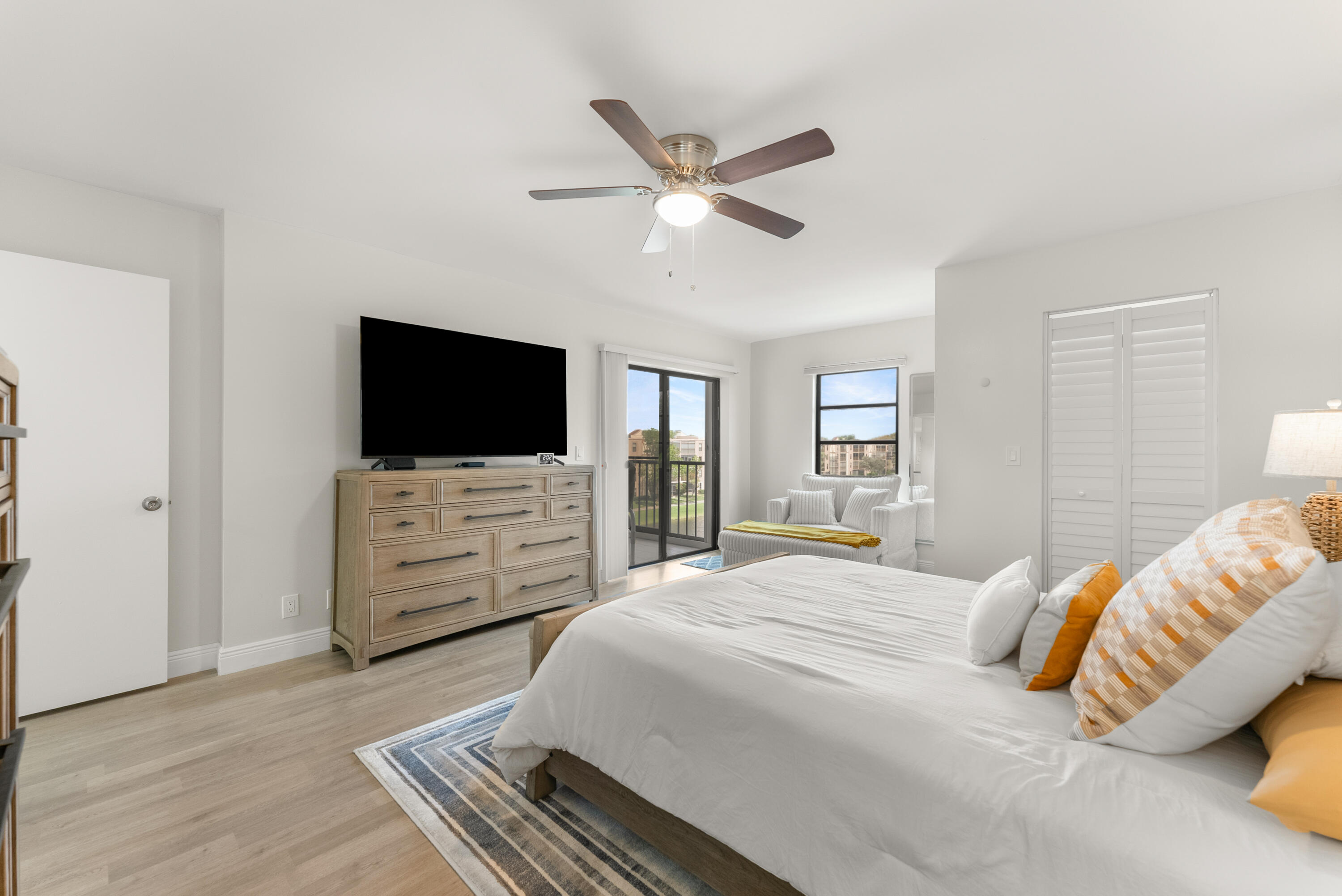 14500 Stirling Way, Unit 403 Delray Beach, FL 33446 - Photo 20 of 47 a bedroom with a bed and a flat screen tv