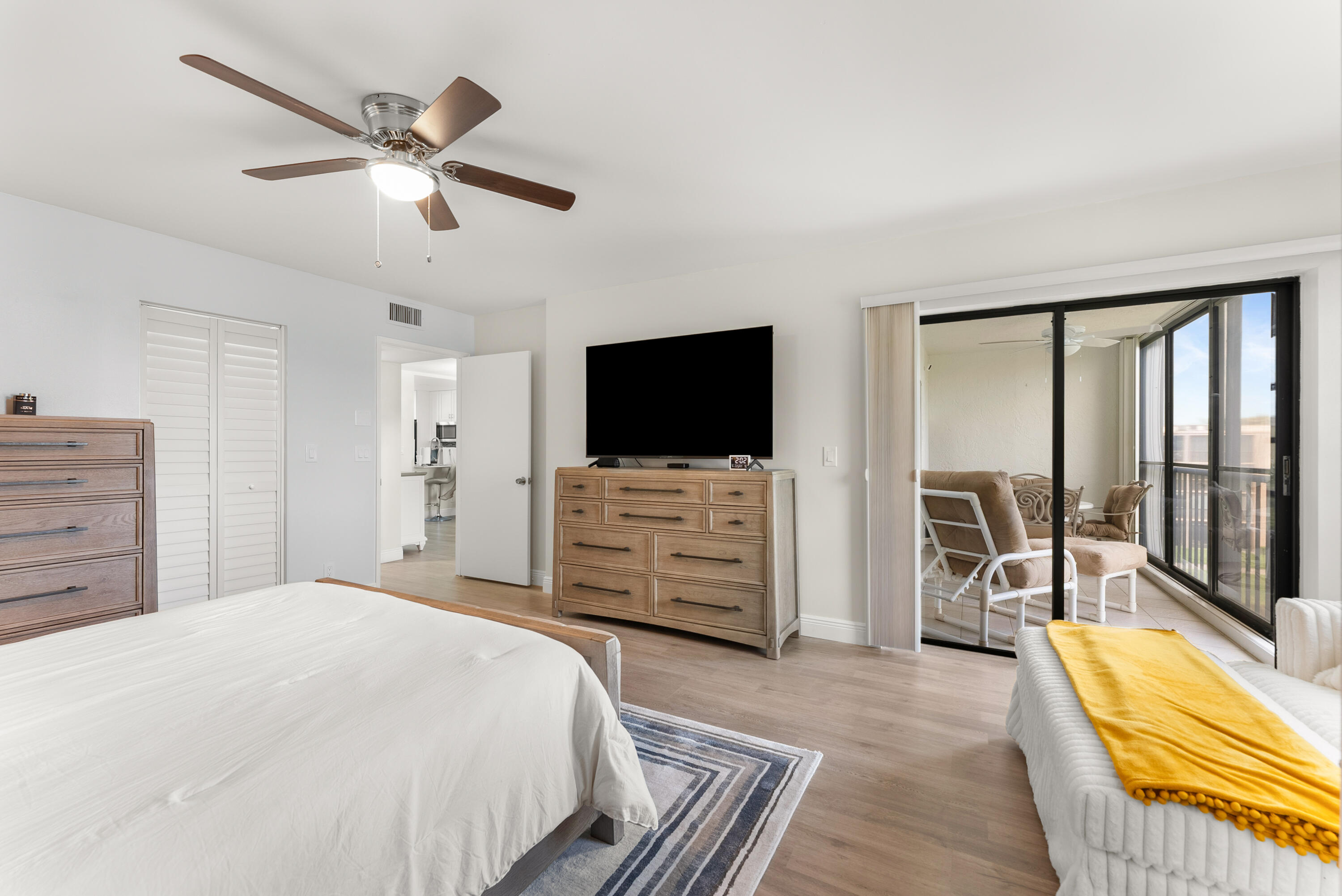 14500 Stirling Way, Unit 403 Delray Beach, FL 33446 - Photo 21 of 47 a bedroom with a bed and a flat screen tv