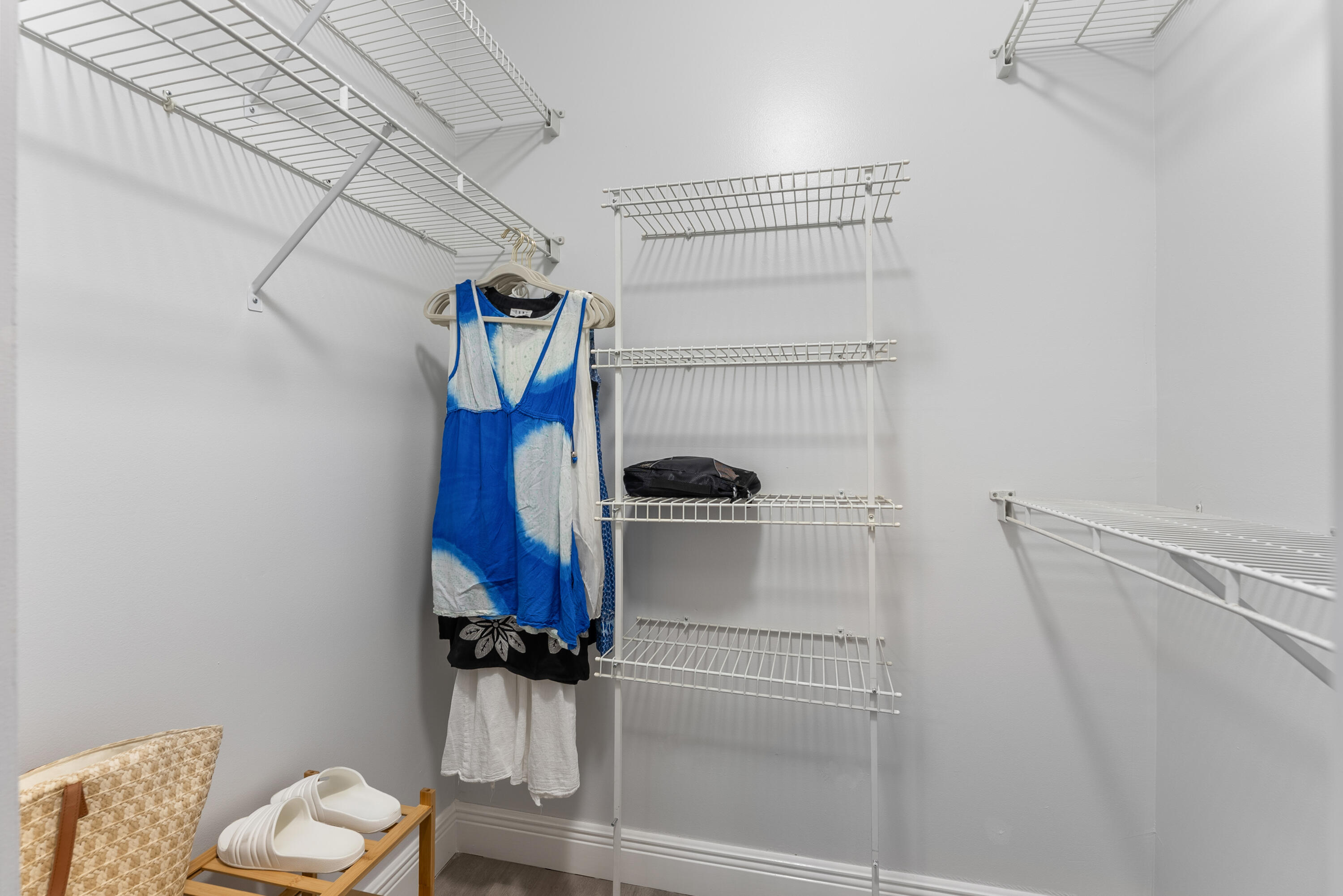 14500 Stirling Way, Unit 403 Delray Beach, FL 33446 - Photo 24 of 47 a view of walk in closet with clothes and shoes