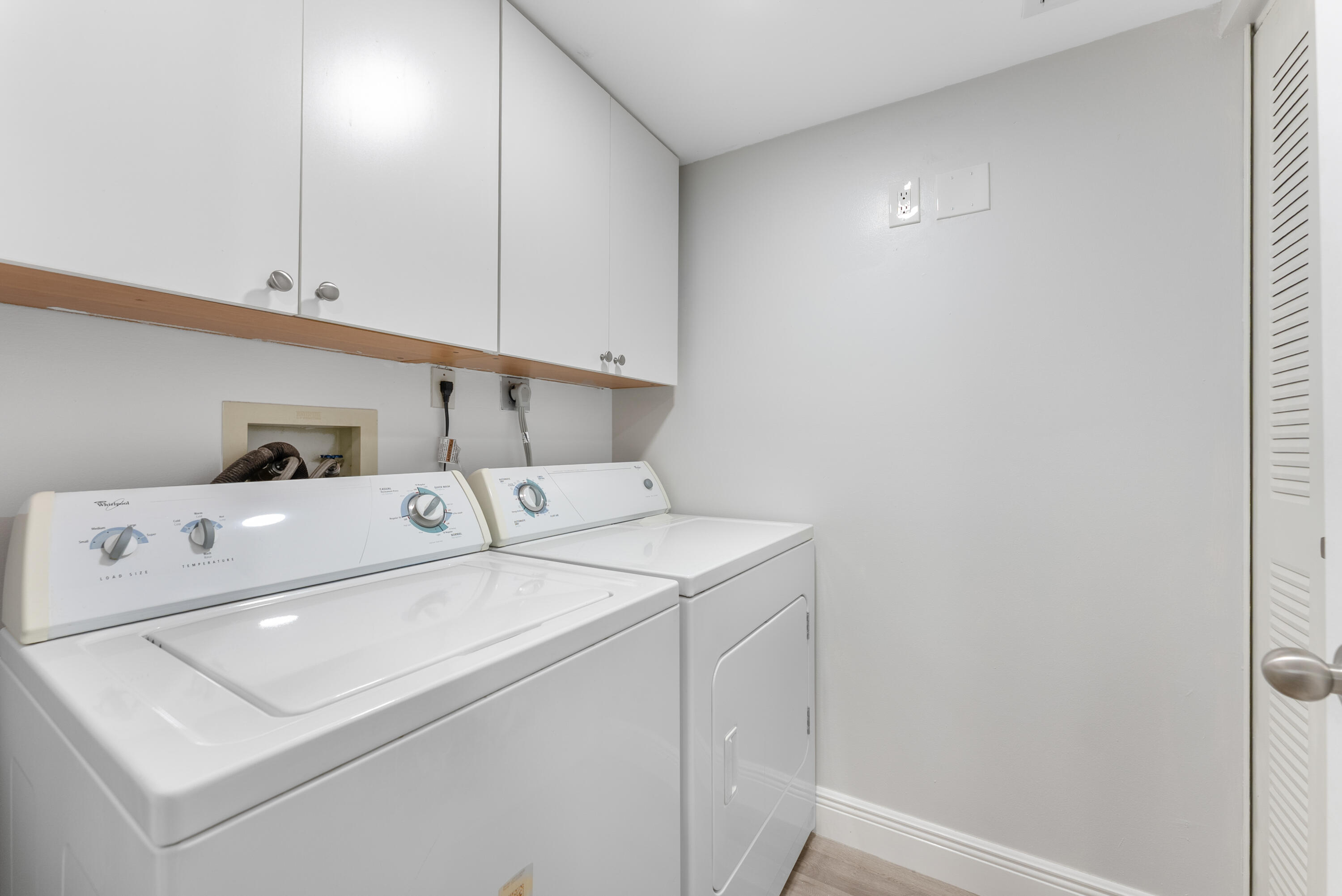14500 Stirling Way, Unit 403 Delray Beach, FL 33446 - Photo 25 of 47 a utility room with dryer and washer