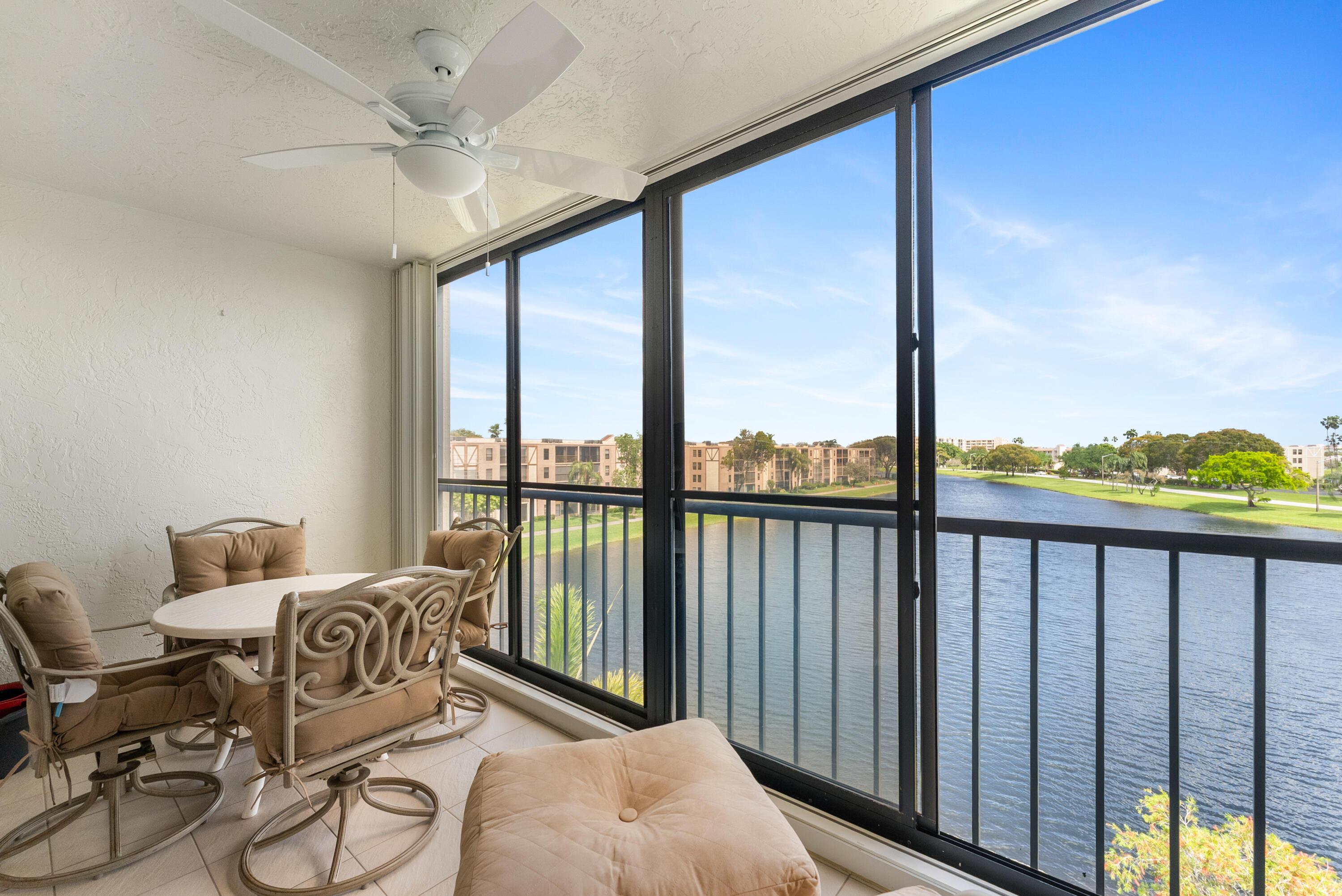 14500 Stirling Way, Unit 403 Delray Beach, FL 33446 - Photo 27 of 47 a view of a balcony with chair and a potted plant