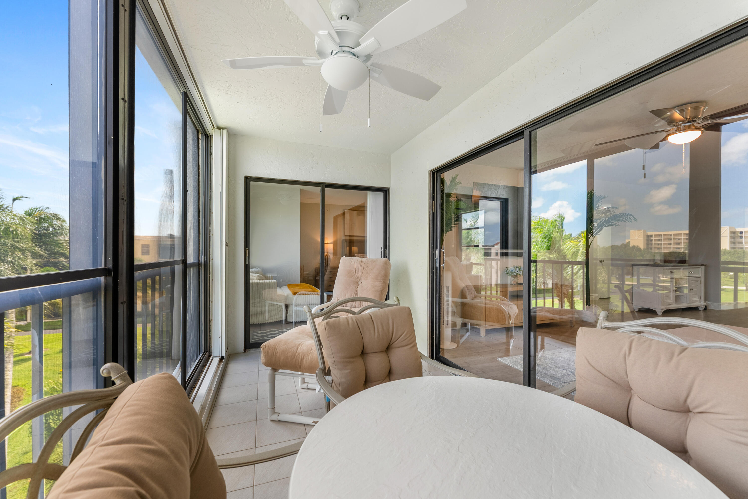 14500 Stirling Way, Unit 403 Delray Beach, FL 33446 - Photo 28 of 47 a living room with furniture and a large window
