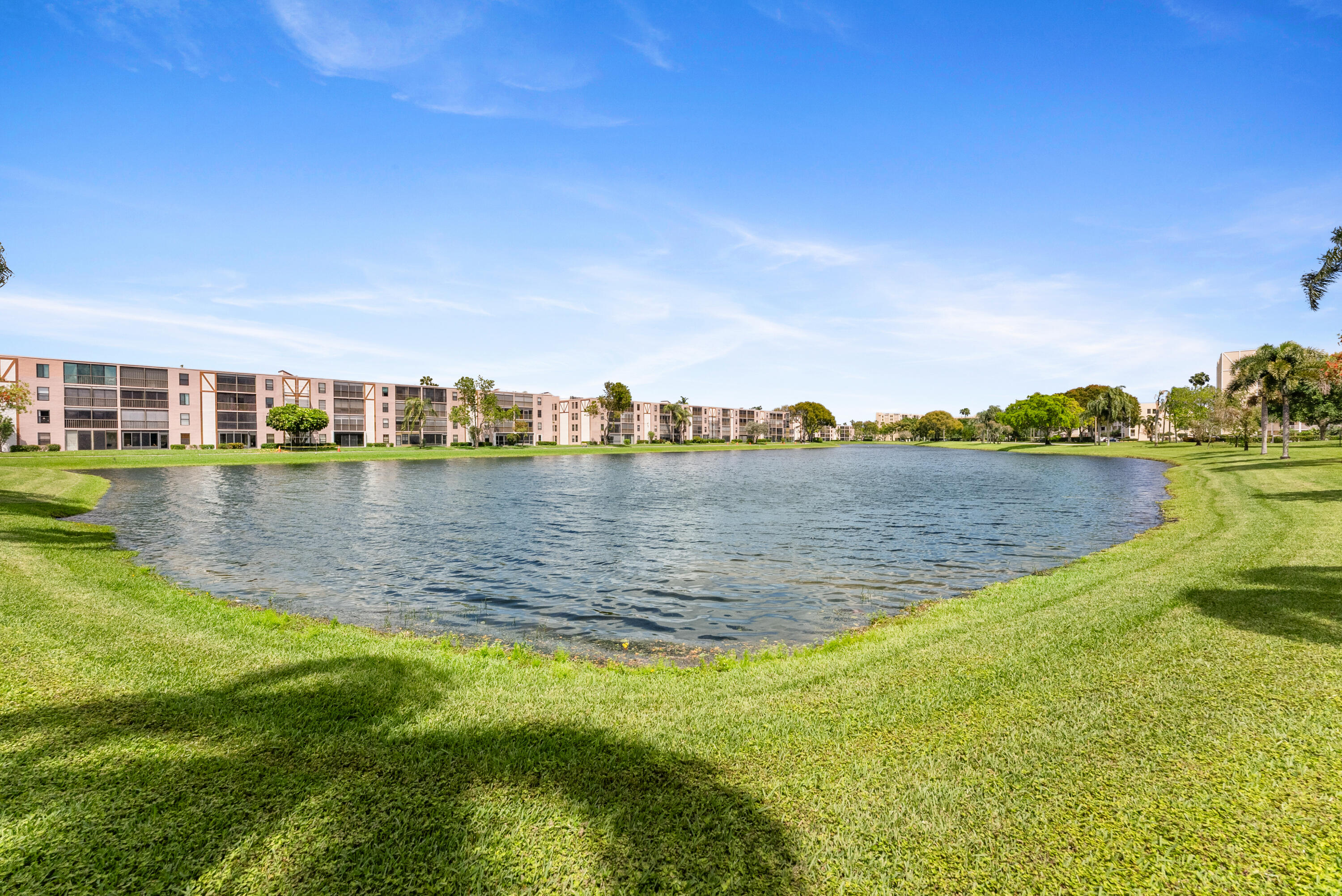 14500 Stirling Way, Unit 403 Delray Beach, FL 33446 - Photo 30 of 47 a view of a lake with houses in the back