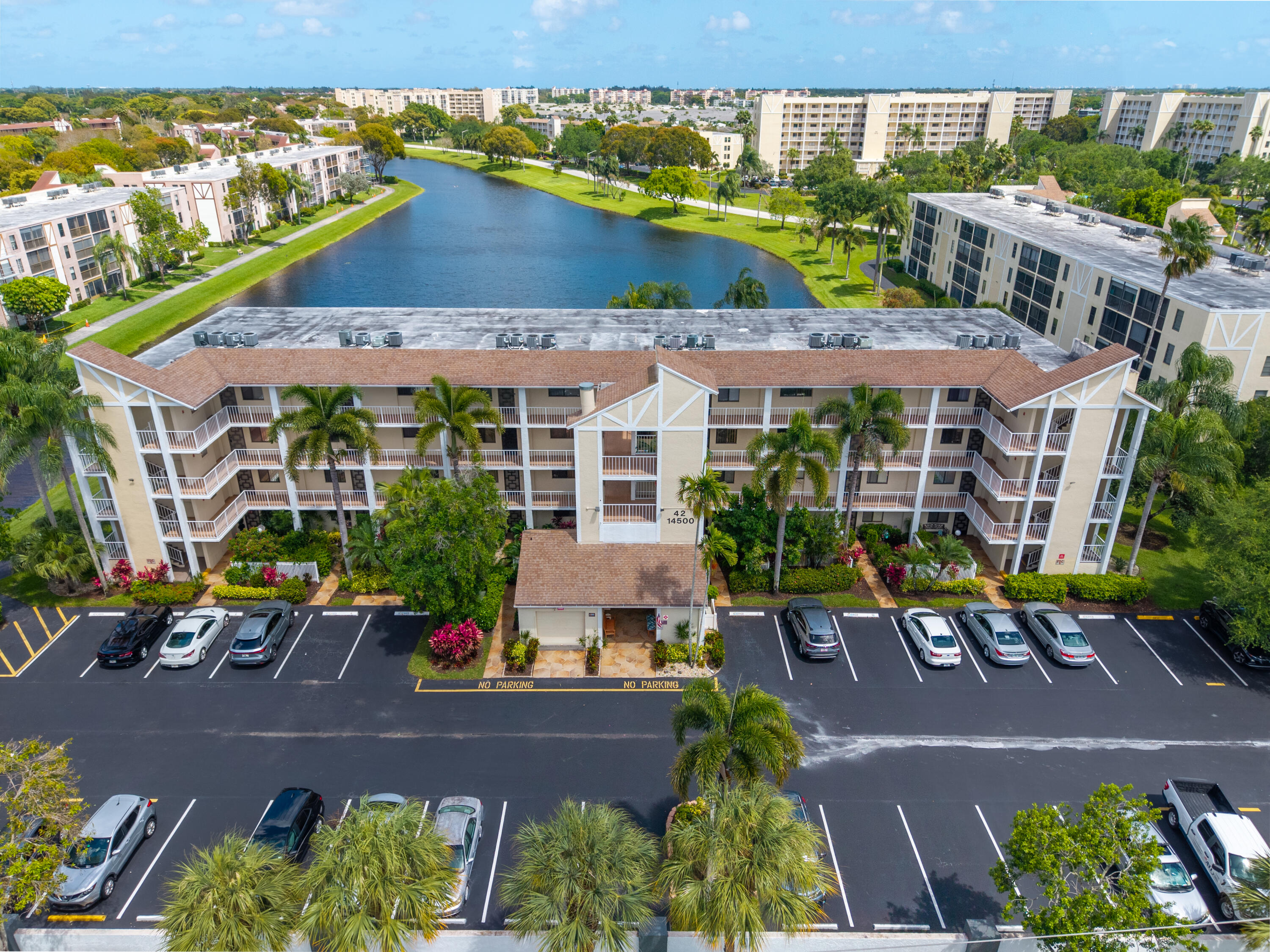 14500 Stirling Way, Unit 403 Delray Beach, FL 33446 - Photo 31 of 47 an aerial view of multiple houses with a lake