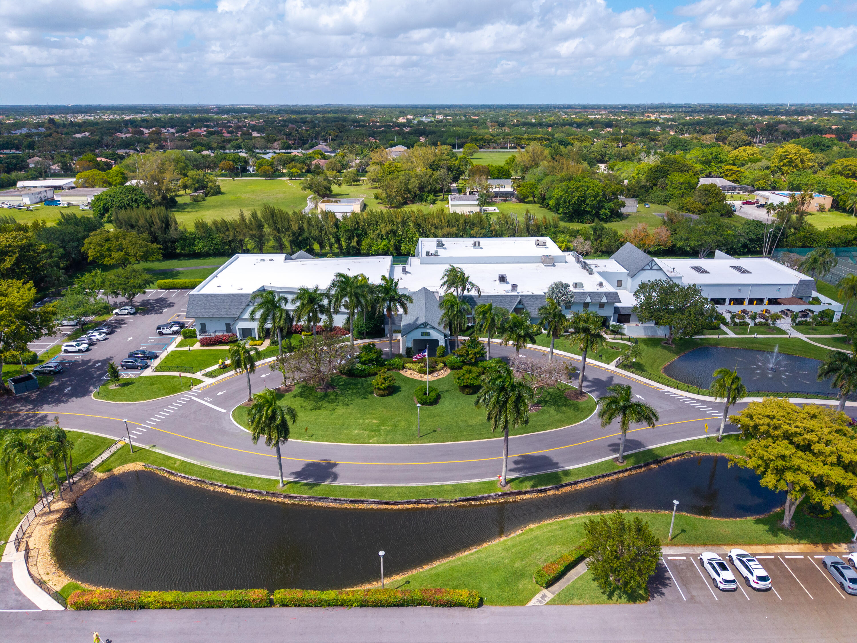 14500 Stirling Way, Unit 403 Delray Beach, FL 33446 - Photo 43 of 47 an aerial view of a house with a garden and lake view