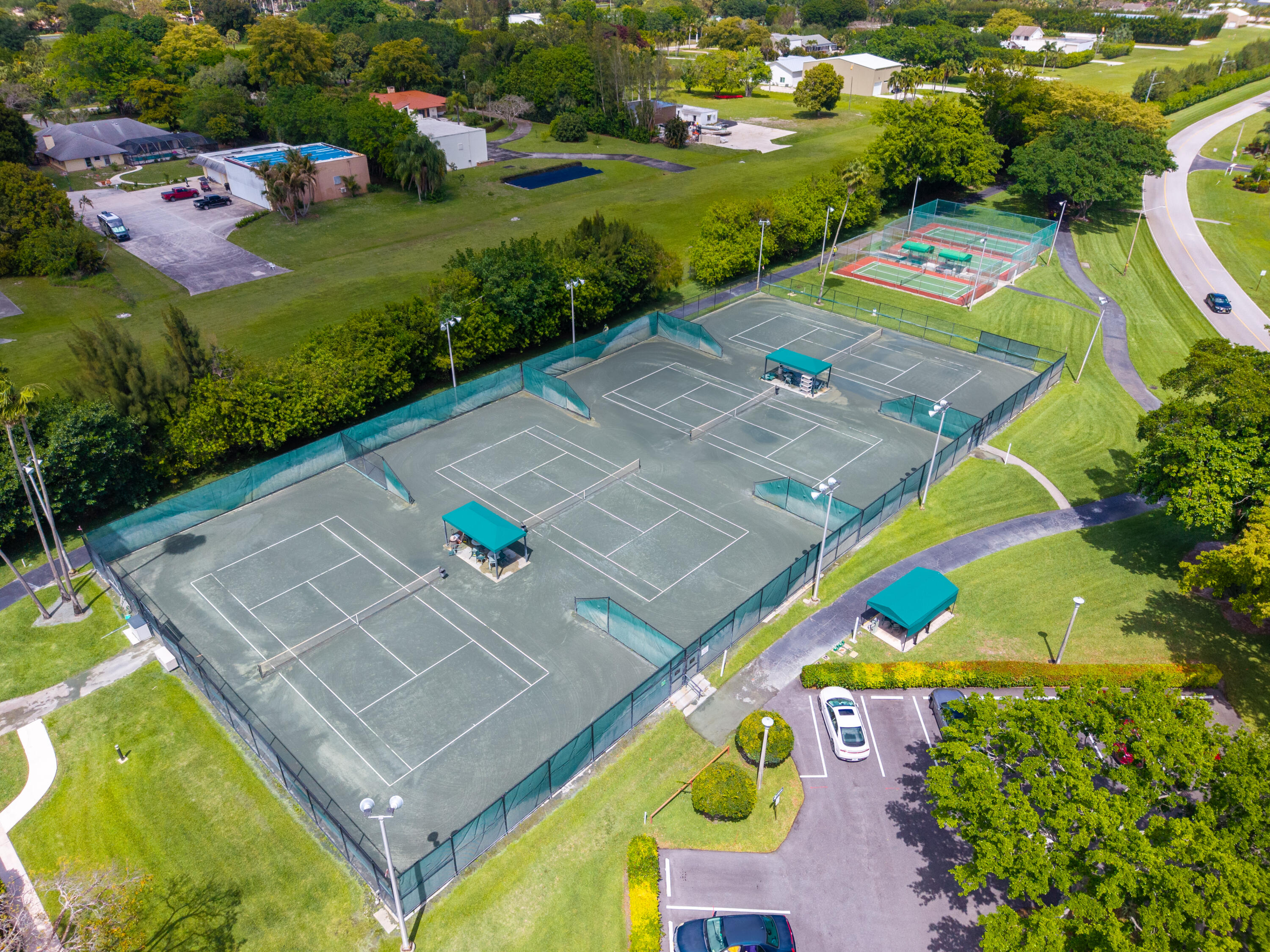 14500 Stirling Way, Unit 403 Delray Beach, FL 33446 - Photo 45 of 47 an aerial view of a swimming pool yard and outdoor seating