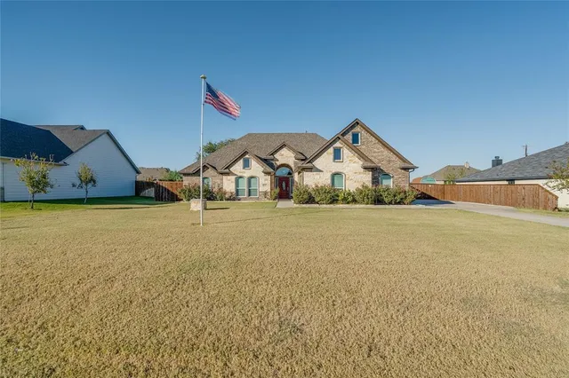 a house with trees in the background