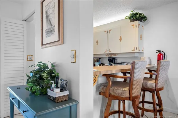 a kitchen with sink and cabinets