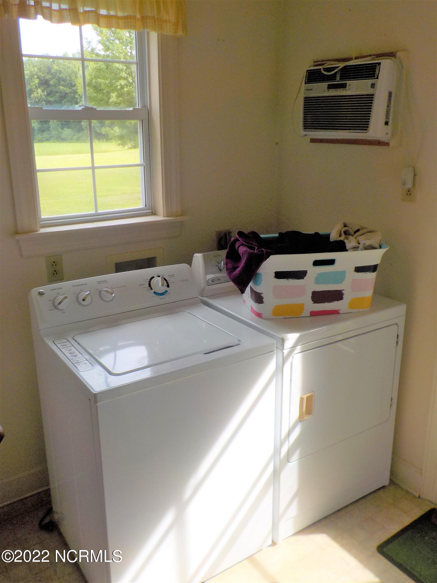 10856 Straight Gate Road Whitakers, NC 27891 - Photo 21 of 41 utility room, washer, dryer, & freezer remain