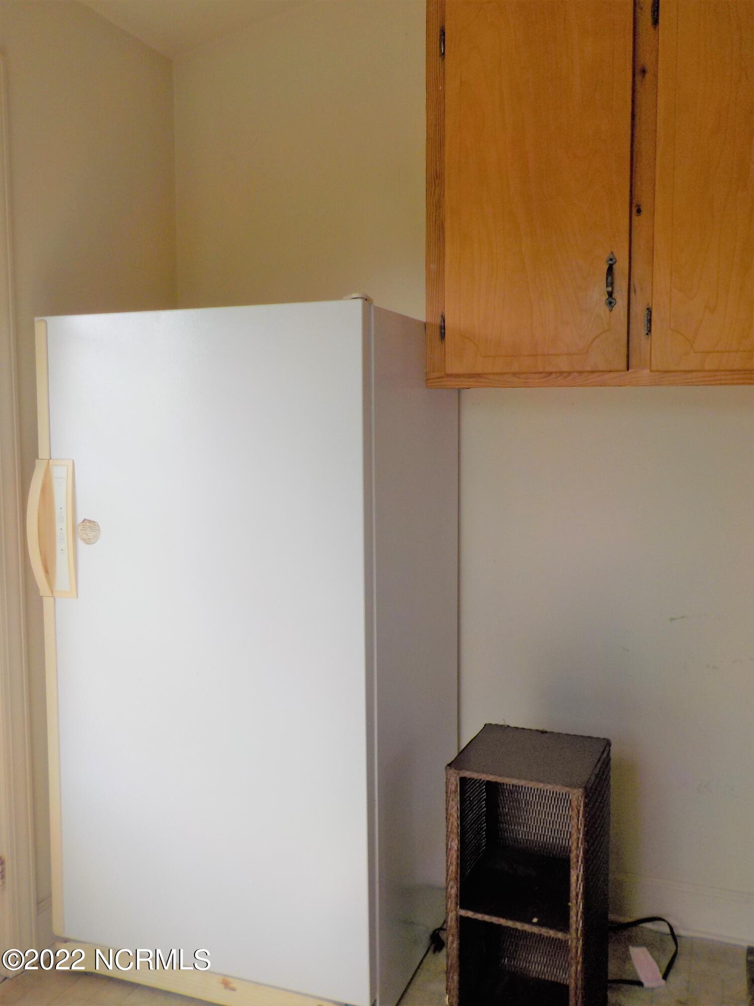 10856 Straight Gate Road Whitakers, NC 27891 - Photo 22 of 41 freezer remains, cabinet space in utility room