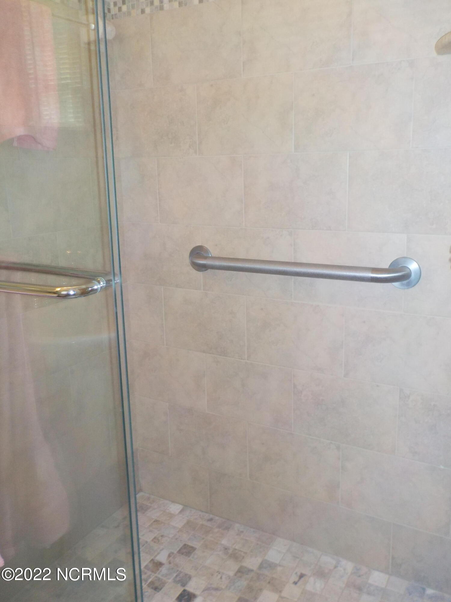 10856 Straight Gate Road Whitakers, NC 27891 - Photo 24 of 41 walk-in tile shower with grab bars