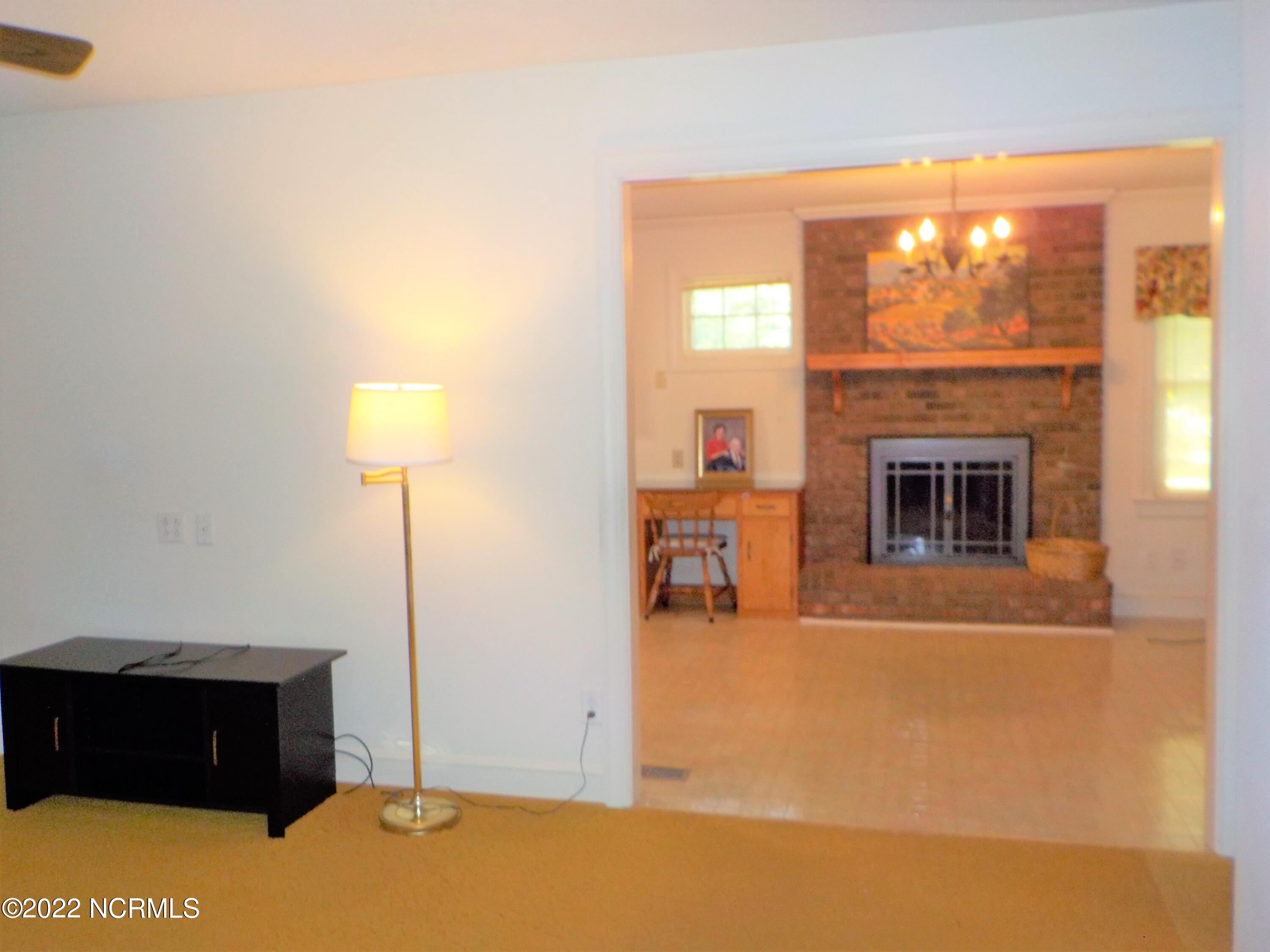 10856 Straight Gate Road Whitakers, NC 27891 - Photo 27 of 41 living room opens up into eat-in kitchen