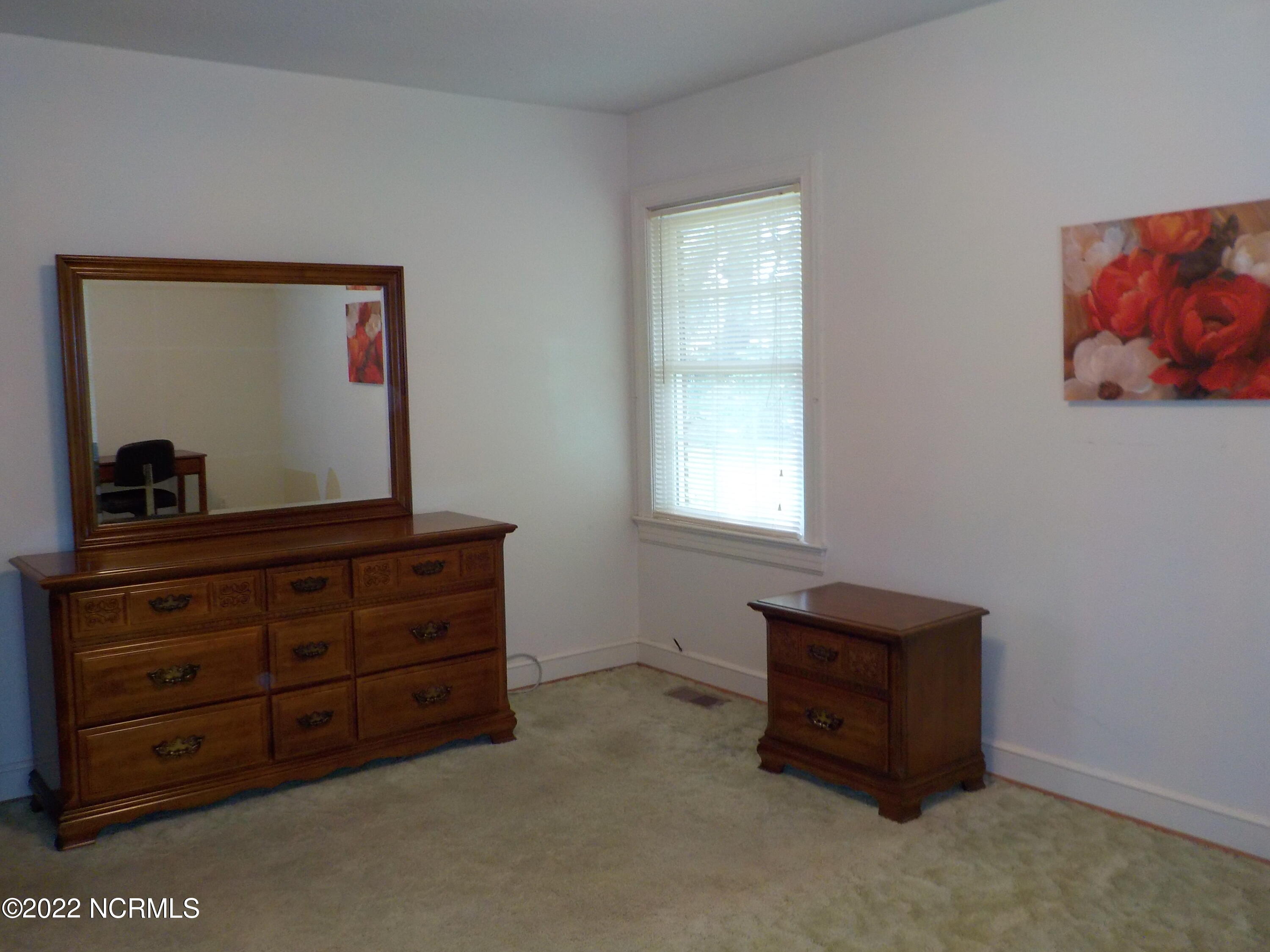 10856 Straight Gate Road Whitakers, NC 27891 - Photo 34 of 41 main bedroom, hardwood under the carpet