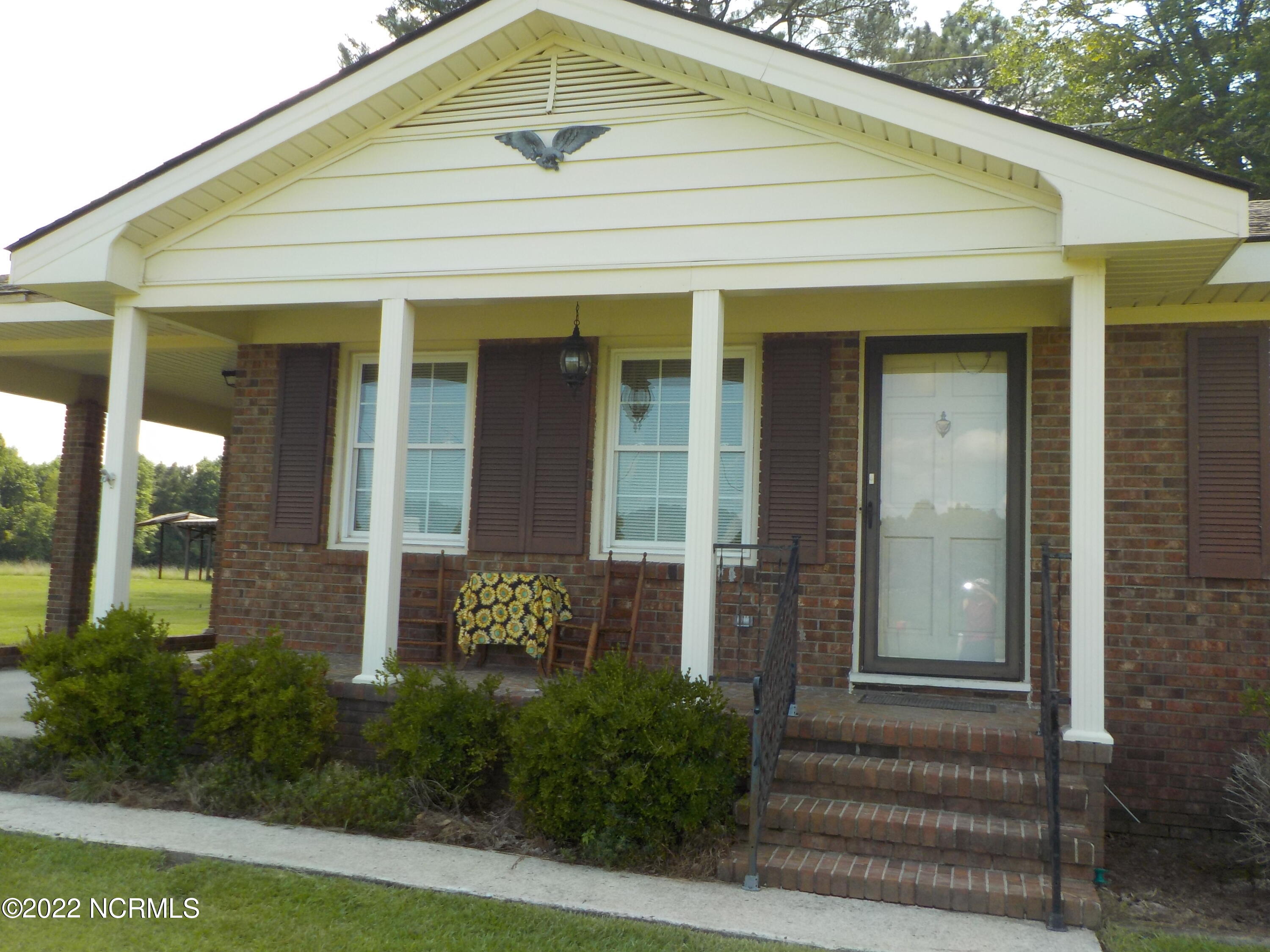 10856 Straight Gate Road Whitakers, NC 27891 - Photo 6 of 41 front porch with broken tile flooring