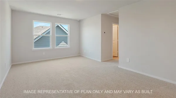 an empty room with windows and mirror