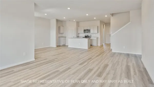 a view of kitchen with wooden floor and window