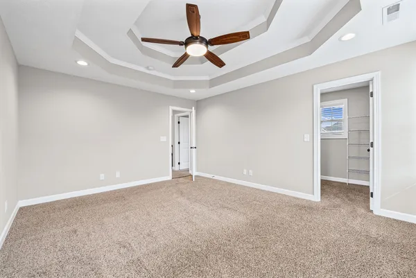 a view of room with ceiling fan