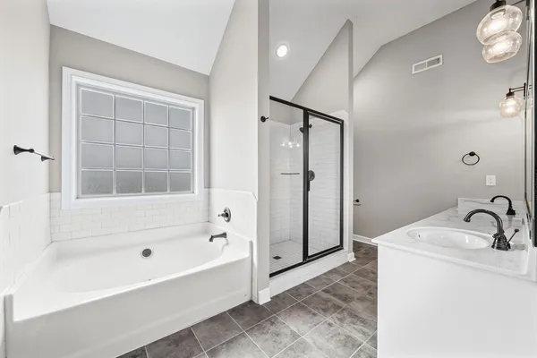 a bathroom with a bathtub and a sink