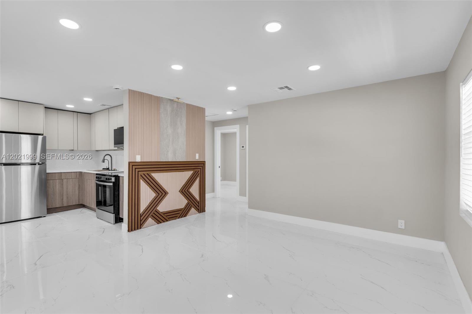 1660 West 26th Street Riviera Beach, FL 33404 - Photo 5 of 28 a view of a kitchen with a sink