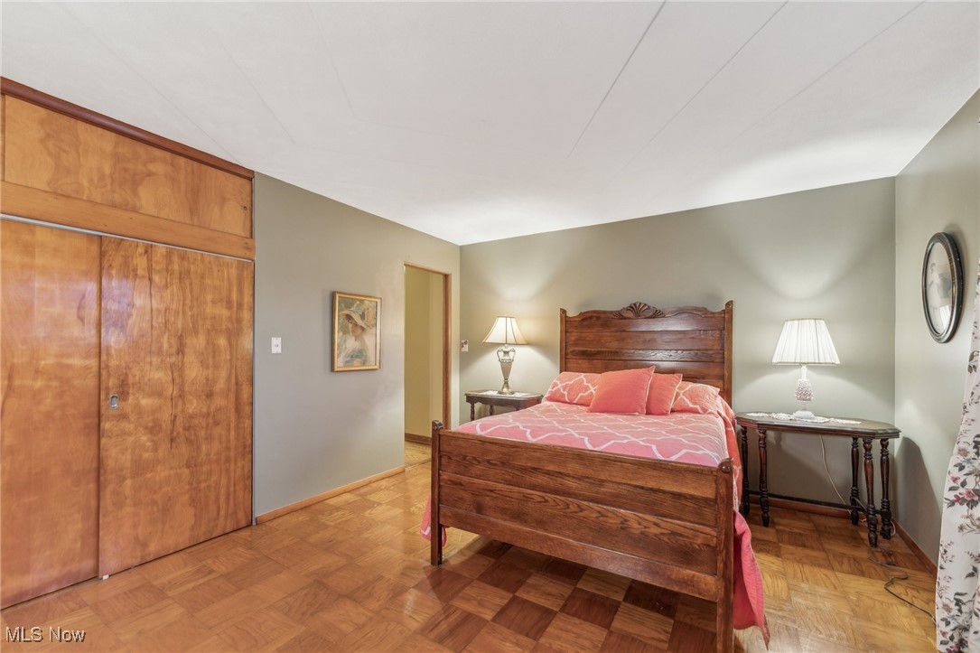 6326 Murray Ridge Road Elyria, OH 44035 - Photo 29 of 49 Bedroom with light parquet flooring and a closet
