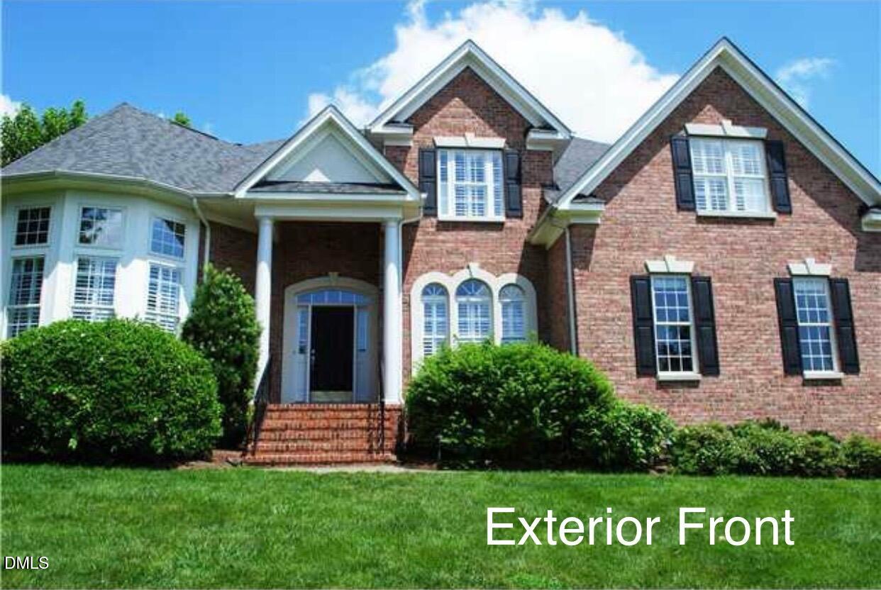 12400 Village Gate Way Raleigh, NC 27614 - Photo 1 of 34 a front view of a house with garden