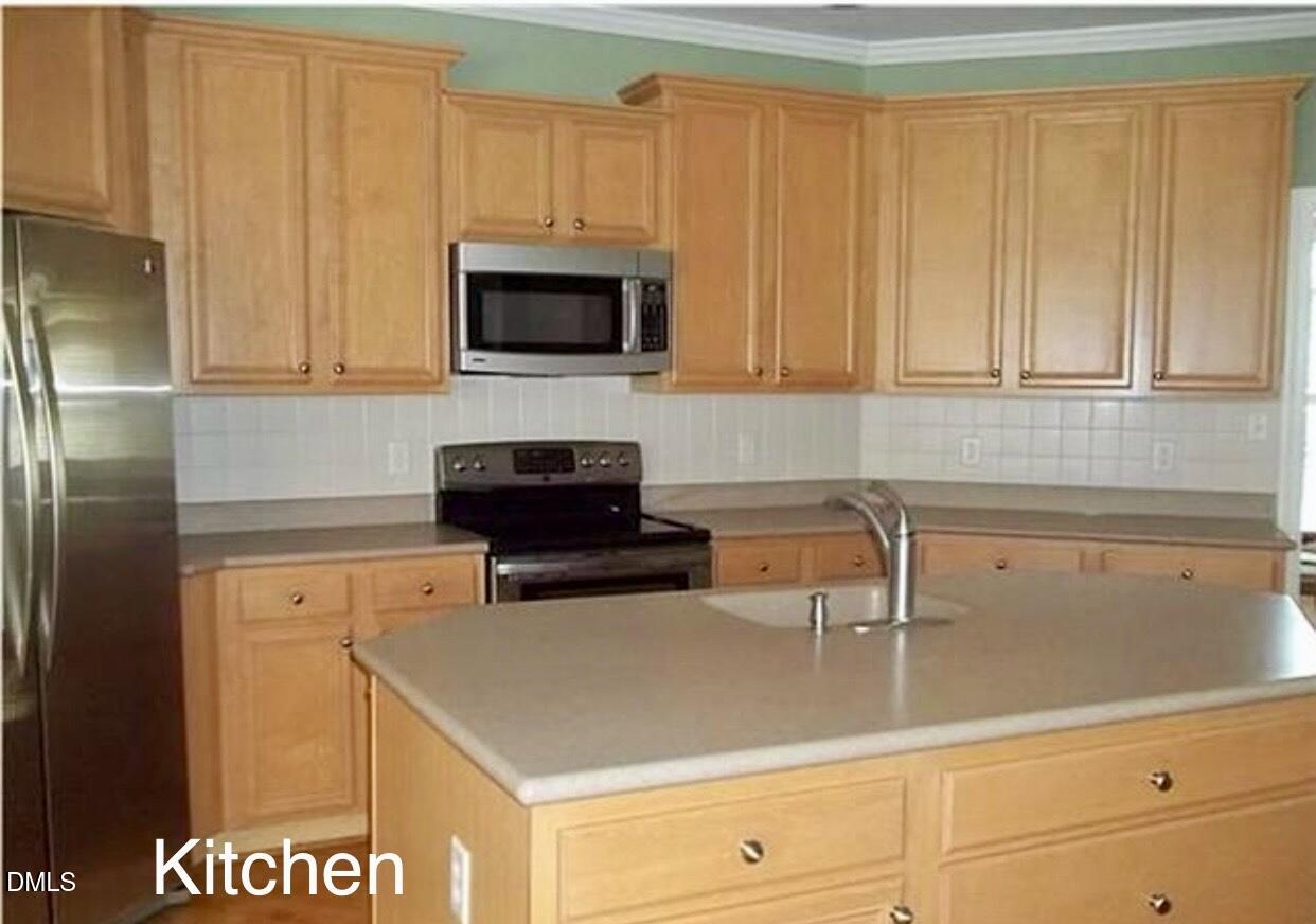 12400 Village Gate Way Raleigh, NC 27614 - Photo 12 of 34 a kitchen with a sink and cabinets