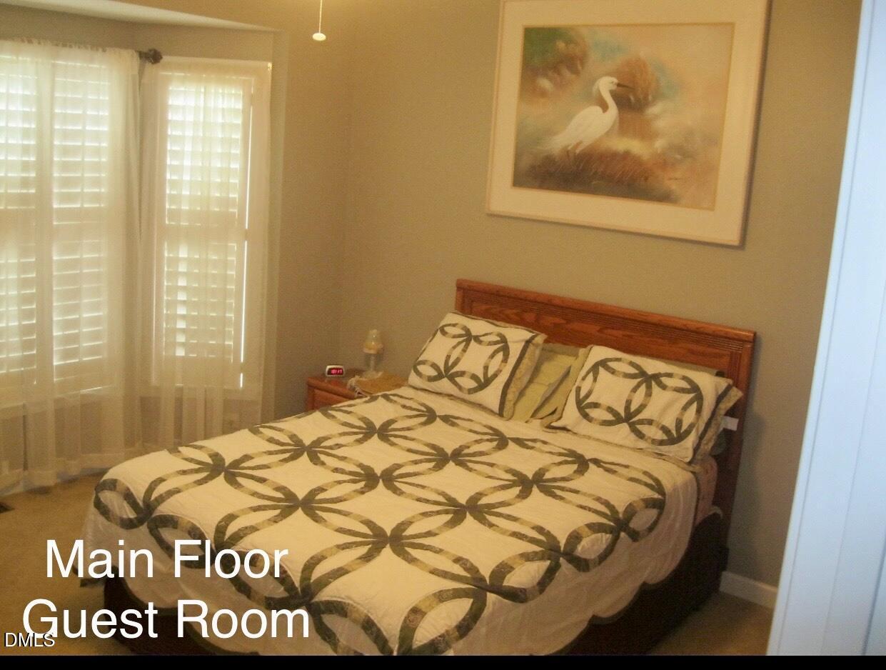 12400 Village Gate Way Raleigh, NC 27614 - Photo 17 of 34 a large bed sitting in a bedroom next to a window