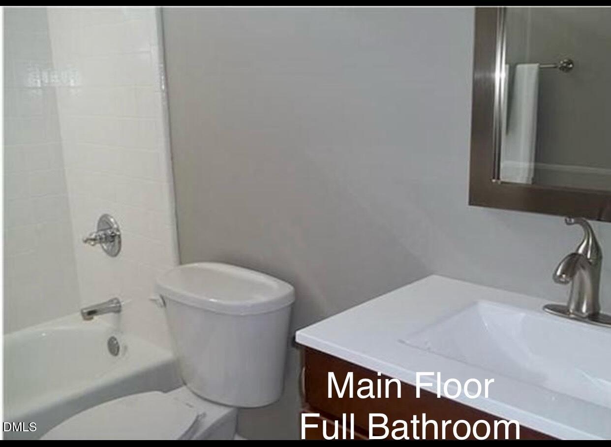 12400 Village Gate Way Raleigh, NC 27614 - Photo 18 of 34 a bathroom with a sink a toilet and shower