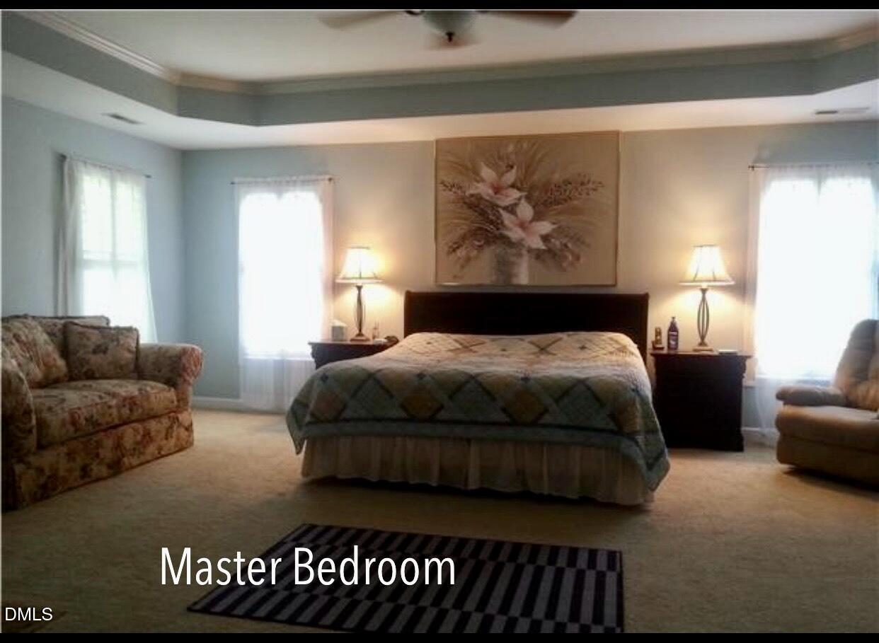 12400 Village Gate Way Raleigh, NC 27614 - Photo 20 of 34 a bedroom with a bed and couch