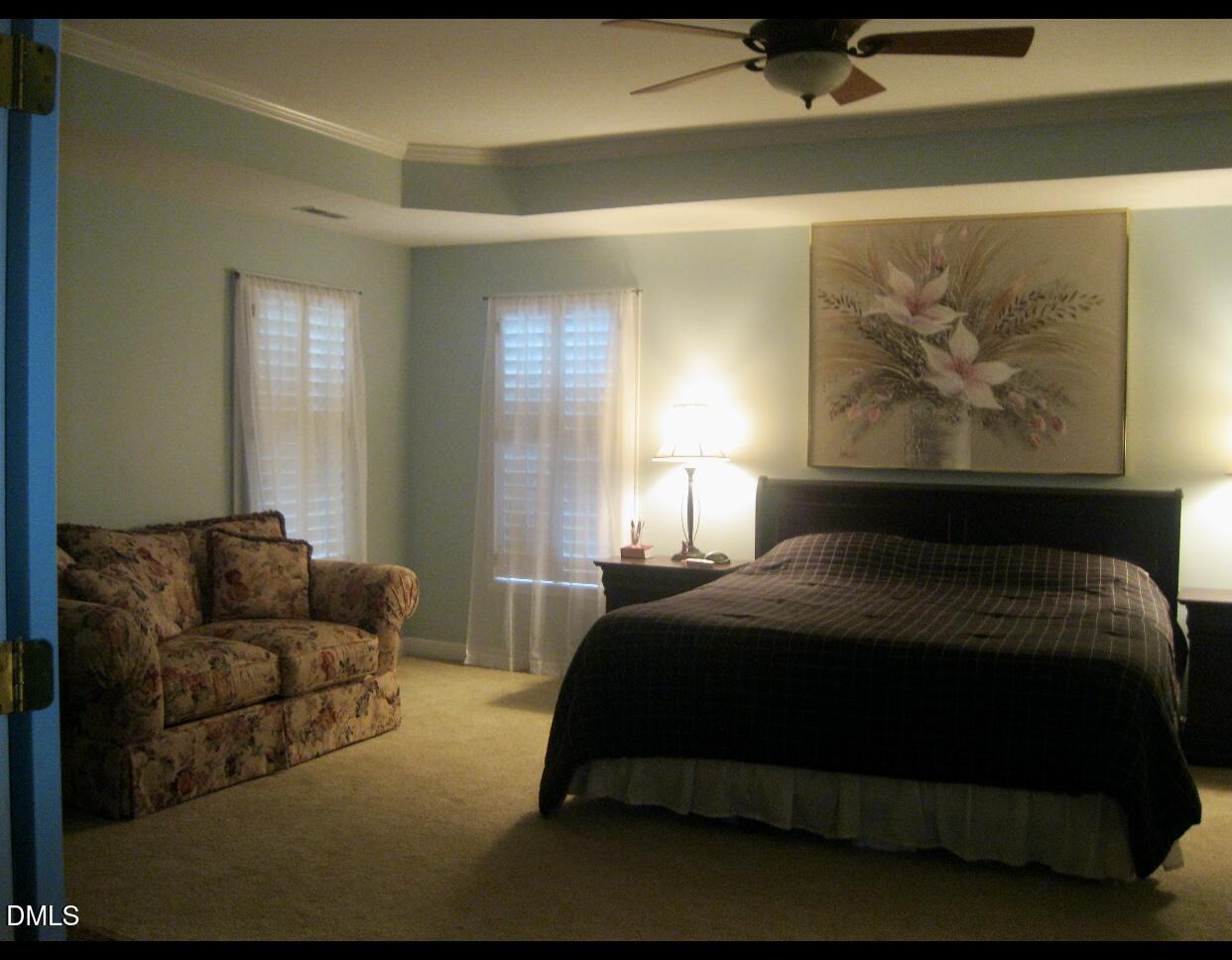 12400 Village Gate Way Raleigh, NC 27614 - Photo 21 of 34 a bedroom with a bed and window
