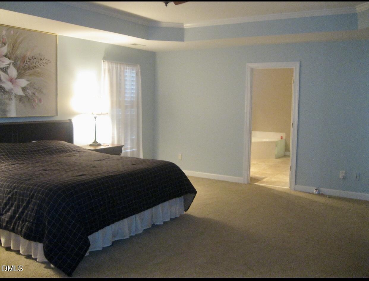 12400 Village Gate Way Raleigh, NC 27614 - Photo 22 of 34 a bedroom with a bed and a window