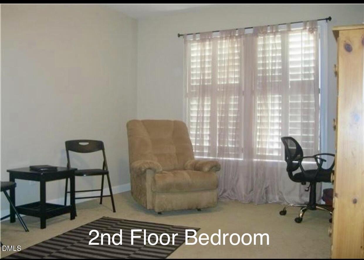 12400 Village Gate Way Raleigh, NC 27614 - Photo 29 of 34 a view of a livingroom with workspace and a window