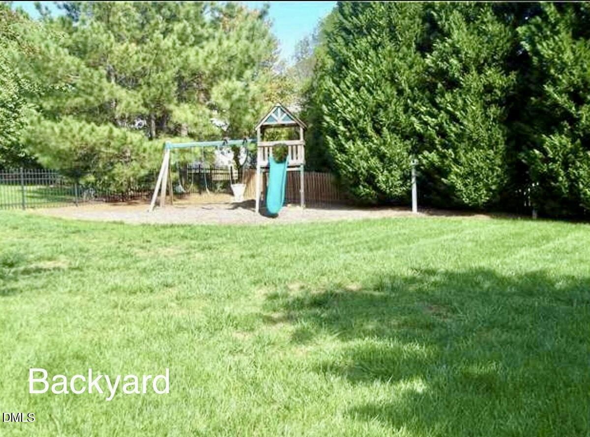 12400 Village Gate Way Raleigh, NC 27614 - Photo 30 of 34 a view of a yard with a house and a park