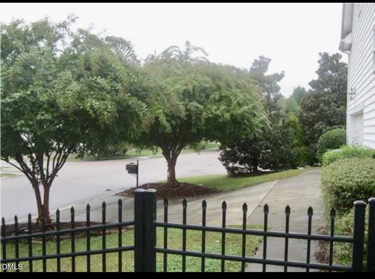 12400 Village Gate Way Raleigh, NC 27614 - Photo 32 of 34 a view of a white house in a yard with large trees