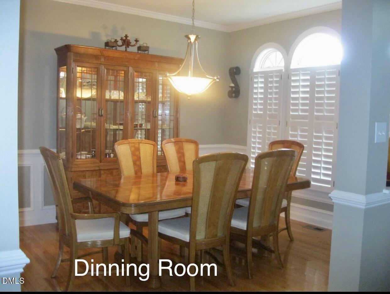 12400 Village Gate Way Raleigh, NC 27614 - Photo 6 of 34 a view of a dining room with furniture and chandelier