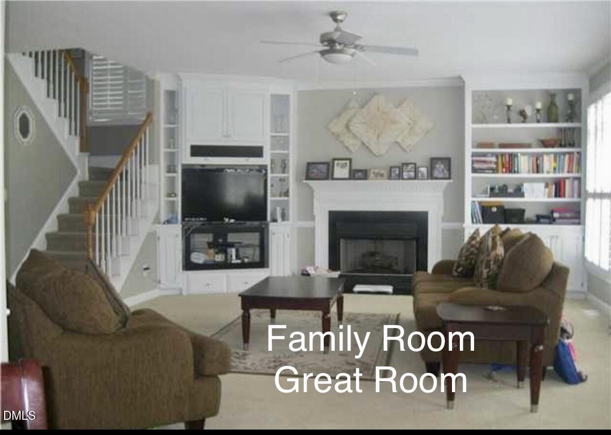 12400 Village Gate Way Raleigh, NC 27614 - Photo 10 of 34 a living room with furniture and a fireplace
