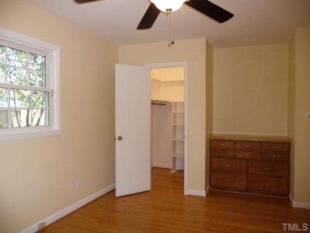122 Lord Ashley Road Raleigh, NC 27610 - Photo 15 of 25 Walk-in closets with built-in shelves are found in each of the downstairs bedrooms.