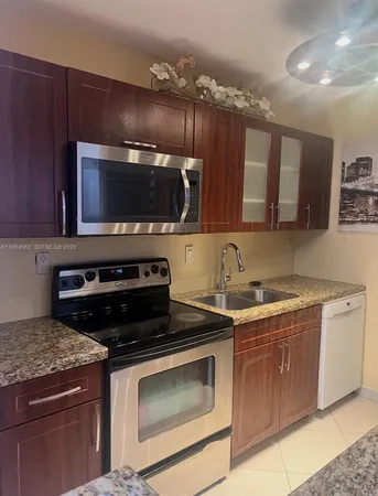 a kitchen with a stove and a microwave