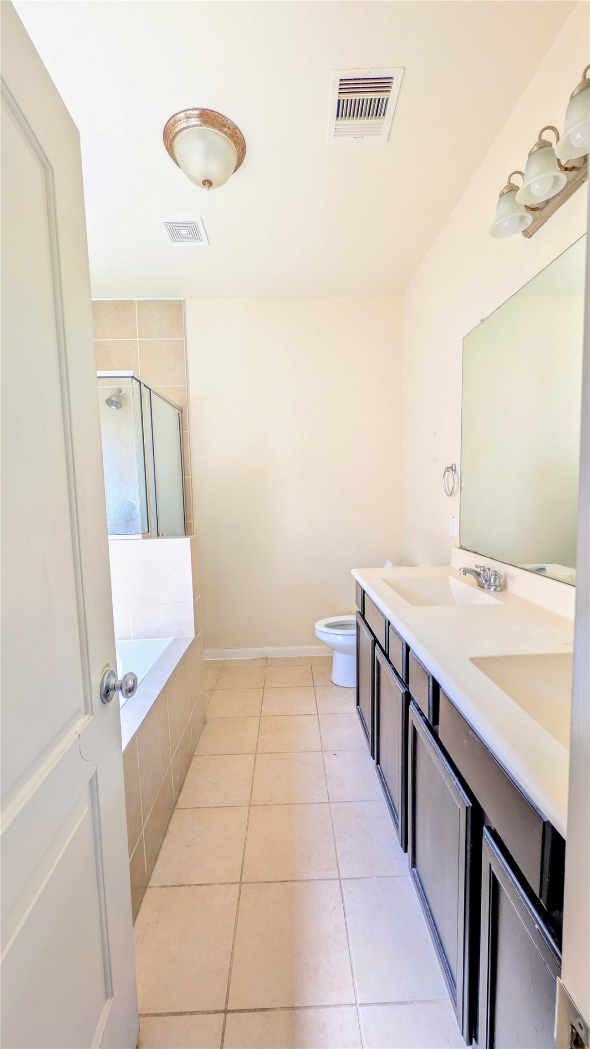 7326 Granite Terrace Lane Houston, TX 77083 - Photo 18 of 39 a kitchen with a sink and a refrigerator