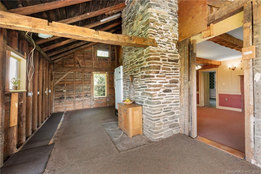 21 Legeyt Road Barkhamsted, CT 06063 - Photo 14 of 37 Currently gutted kitchen with stunning stone fireplace ready for your home renovations