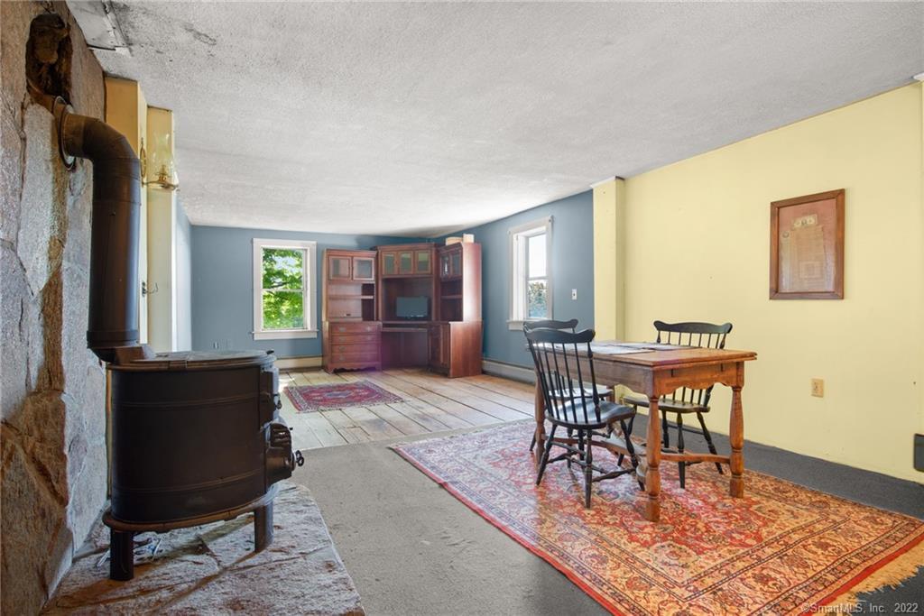 21 Legeyt Road Barkhamsted, CT 06063 - Photo 24 of 37 Upstairs family room. Seller removing wood stove.