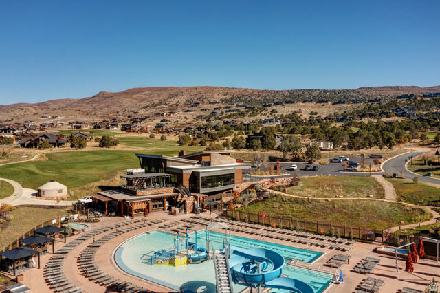 707 Chimney Rock Road, Unit 247 Heber City, UT 84032 - Photo 58 of 64 Drone / aerial view of a mountain backdrop and a golf course
