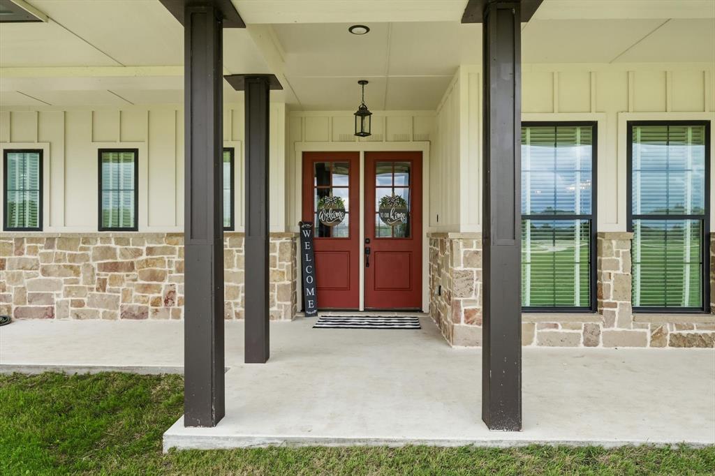 6020 Honeysuckle Road Midlothian, TX 76065 - Photo 4 of 39 Covered front entry featuring robust dark pillars and a concrete porch