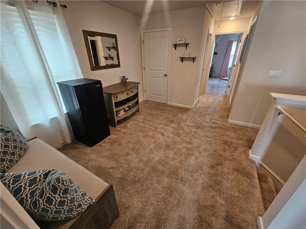 902 Ashwood Lane Easley, SC 29640 - Photo 18 of 39 A versatile secondary living space with soft carpet flooring provides comfort and function.