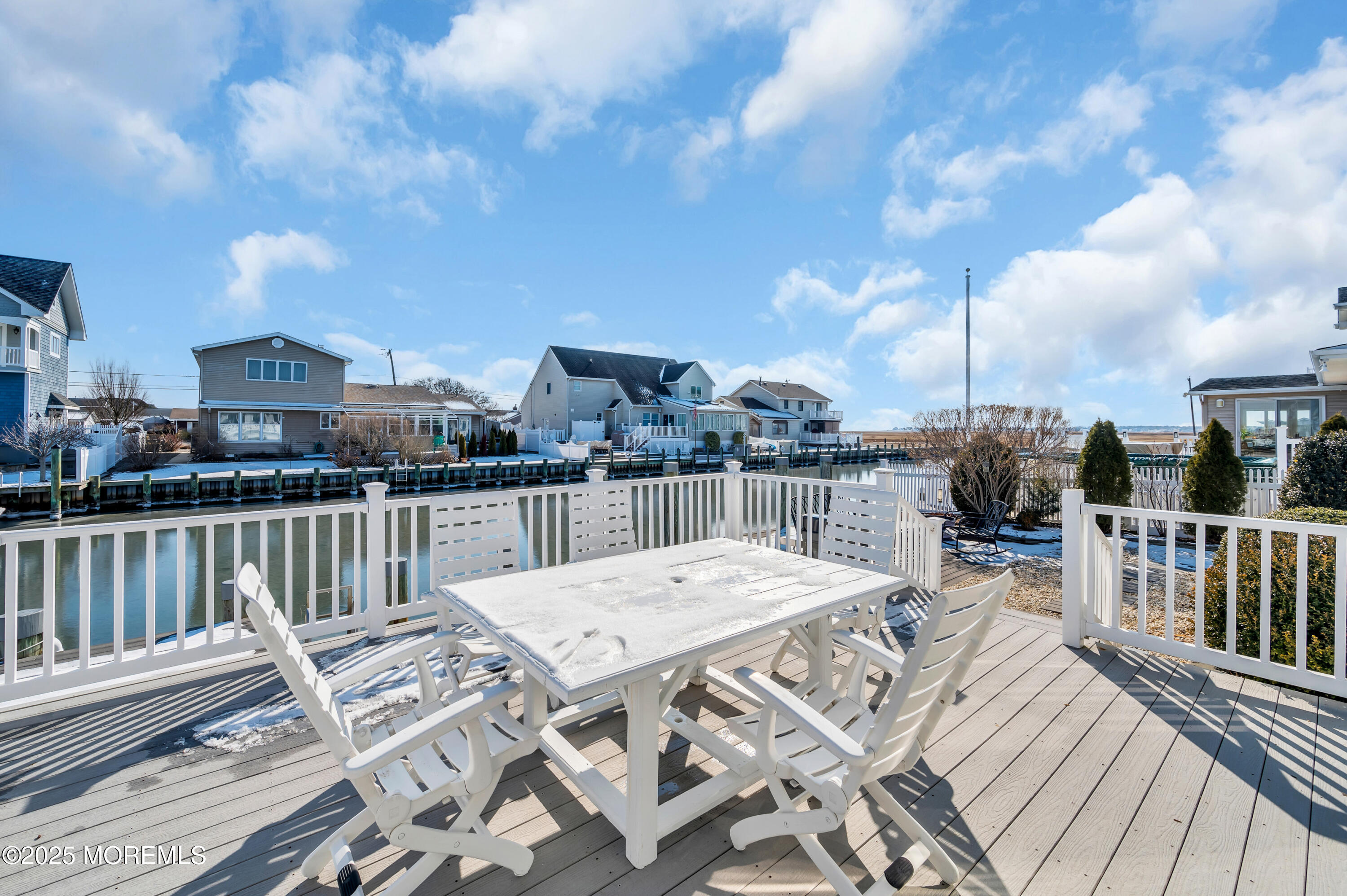 837 Forepeak Drive Forked River, NJ 08731 - Photo 12 of 55 a view of a balcony with two chairs and a table