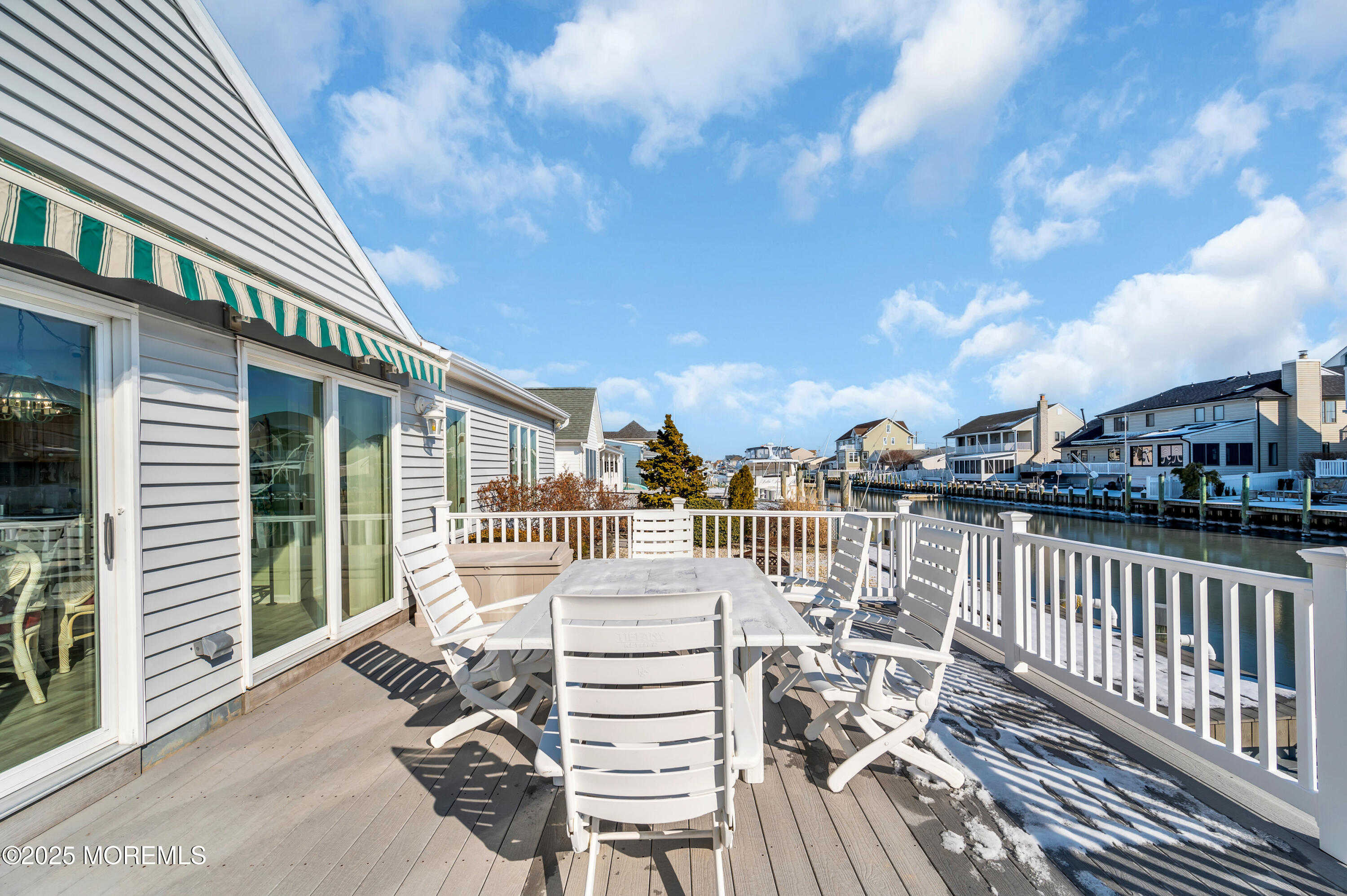 837 Forepeak Drive Forked River, NJ 08731 - Photo 13 of 55 a view of a balcony with two chairs and a table