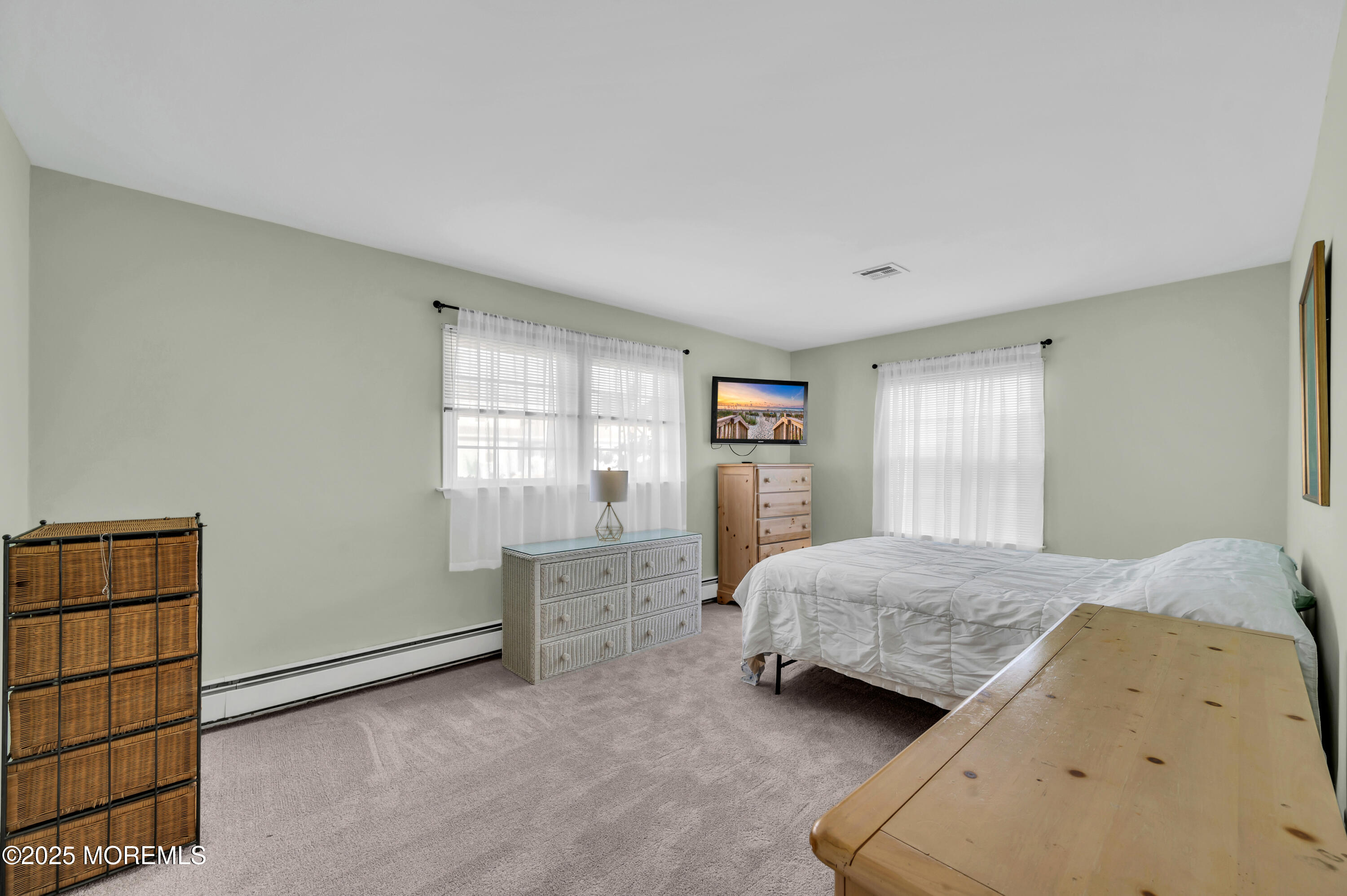 837 Forepeak Drive Forked River, NJ 08731 - Photo 16 of 55 a bedroom with a bed and a window