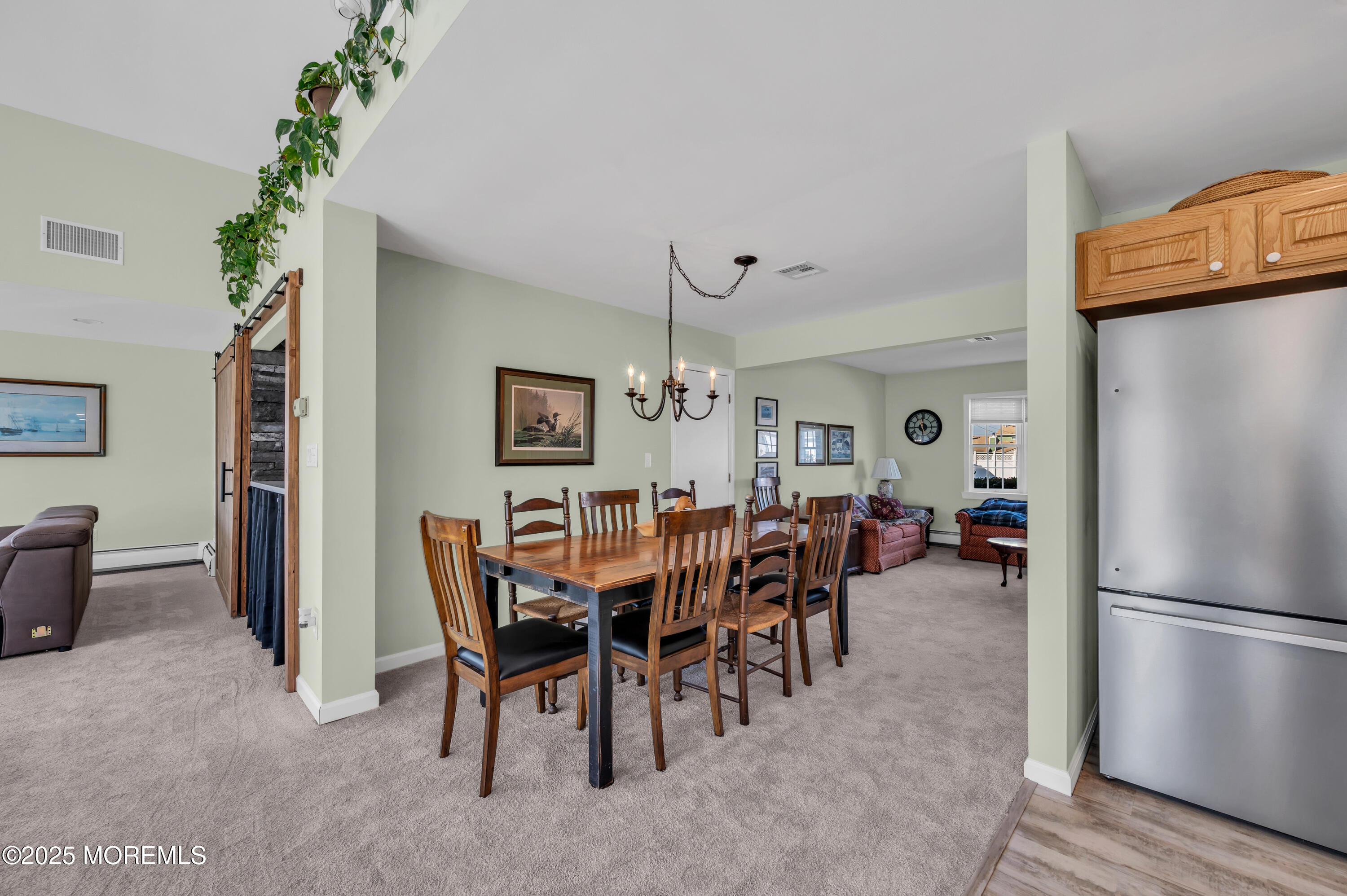 837 Forepeak Drive Forked River, NJ 08731 - Photo 20 of 55 a view of a dining room with furniture window and wooden floor