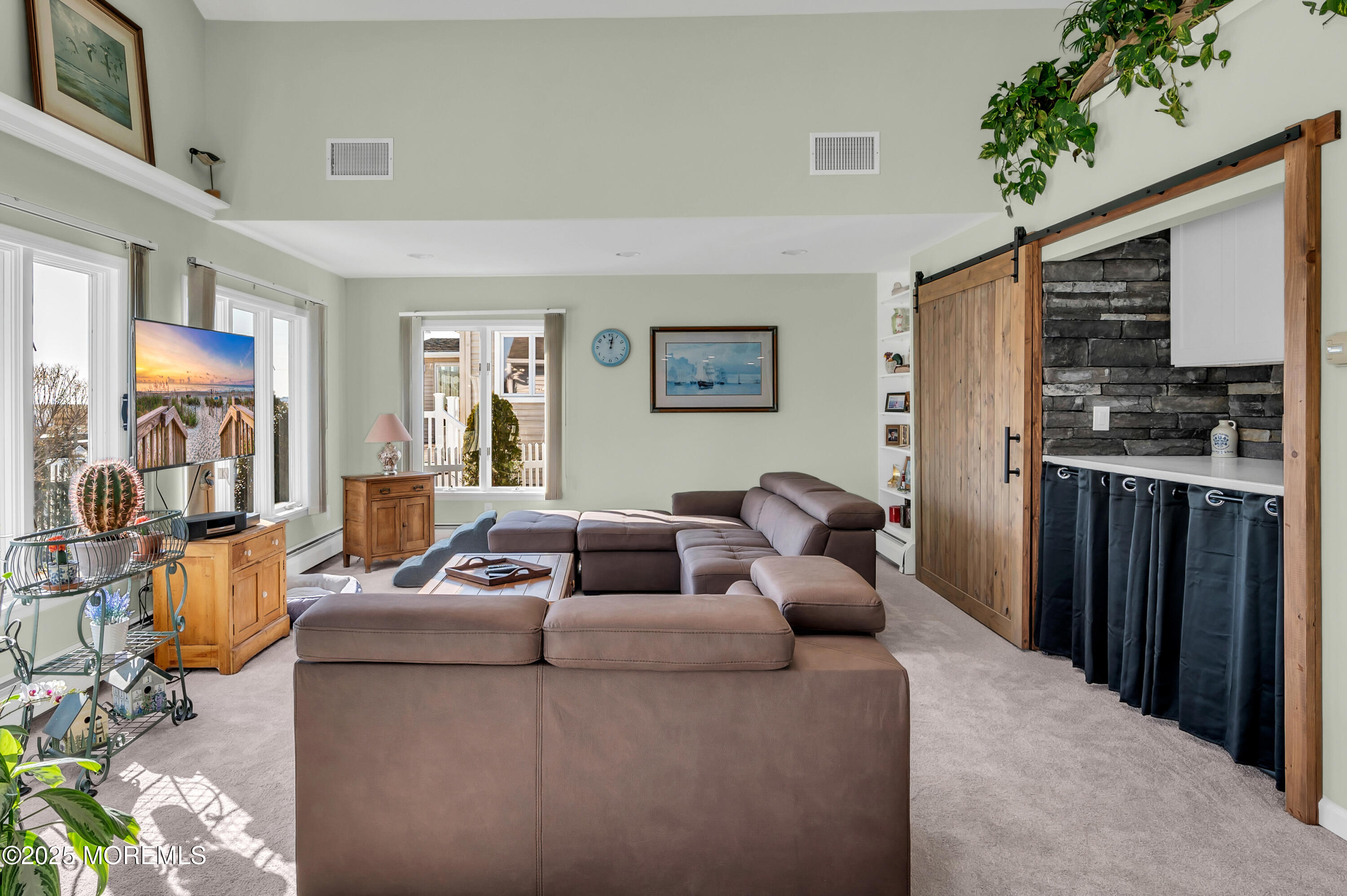 837 Forepeak Drive Forked River, NJ 08731 - Photo 26 of 55 a living room with furniture and a flat screen tv